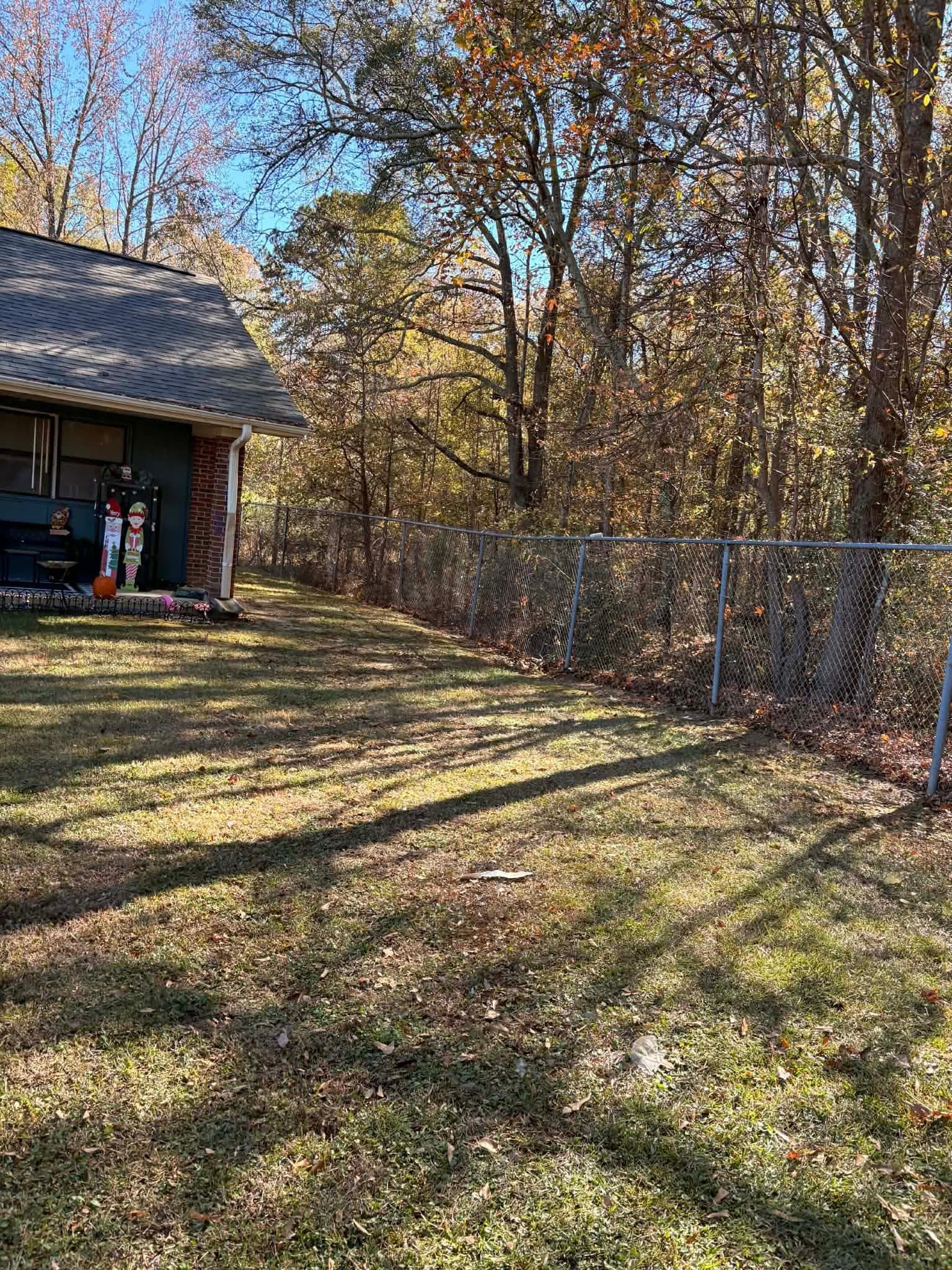 Landscaper installing fresh sod on a prepared lawn
