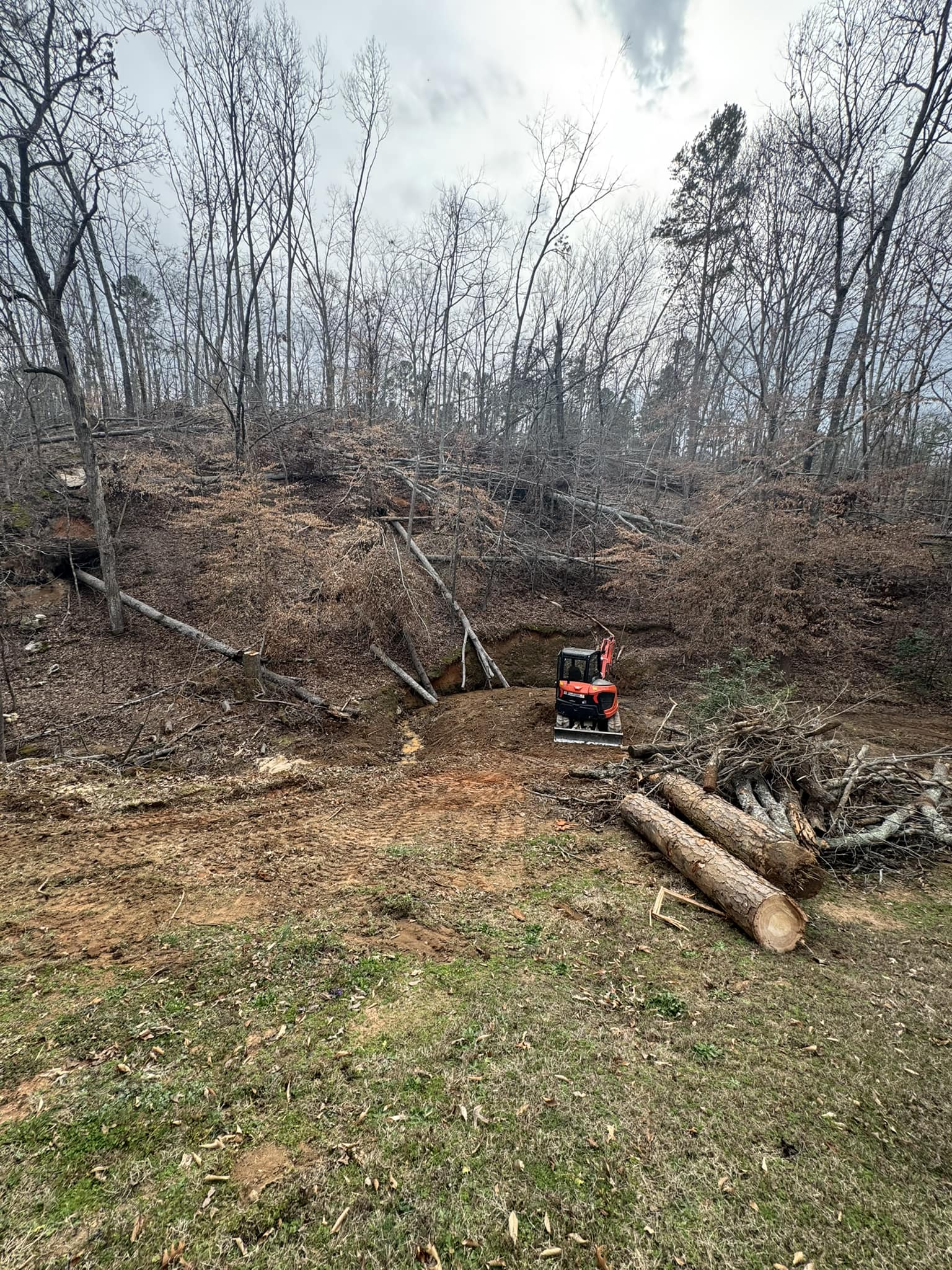 Landscaper mulching a flower bed at a Laurens home